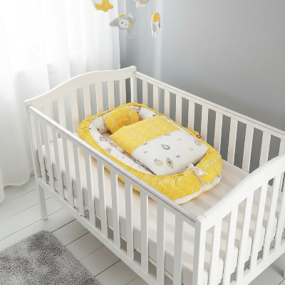 réducteur de lit berceau