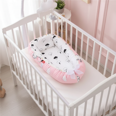 cocon lit bébé rose