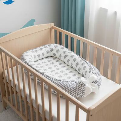 réducteur de lit bébé