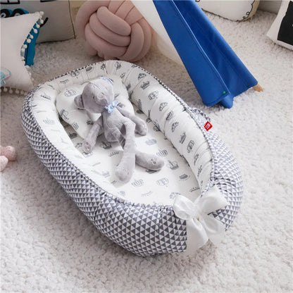 Le réducteur de lit bébé pour un cocon douillet